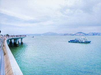 Scenic view of sea against cloudy sky