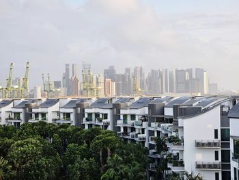 Buildings in city against sky