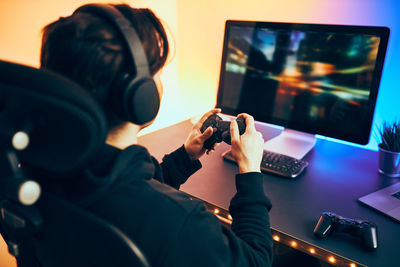 Man playing video game. gamer playing championship tournament. competition and fun. gaming room