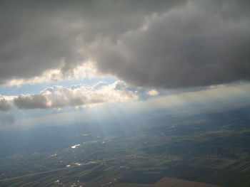 Aerial view of landscape against cloudy sky
