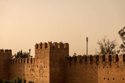Panoramic view of people in city against sky