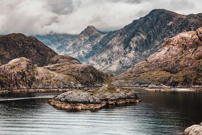 Scenic view of lake and mountains against sky