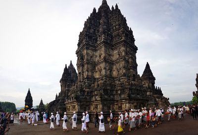 Group of people in temple against building