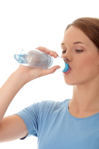 Close-up portrait of a boy drinking glass