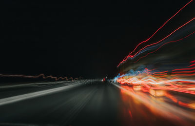 Light trails in sky at night