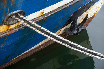 High angle view of rope tied to boat