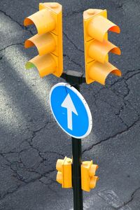 High angle view of road sign on street
