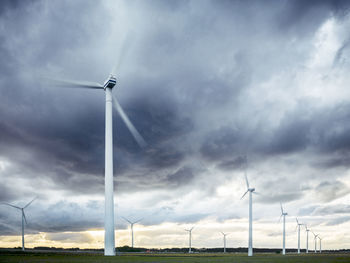 Wind turbines under evening sky