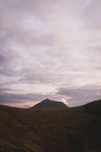 View of landscape against cloudy sky