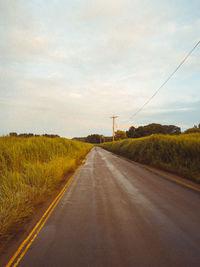 Empty road against sky