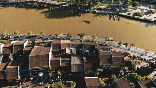 High angle view of river by buildings in city