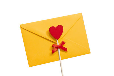 Close-up of red gift box against white background