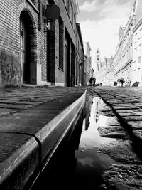 Puddle on footpath in city