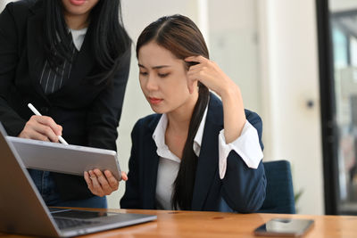 Business colleagues working in office