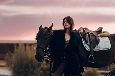 Horse standing against sky