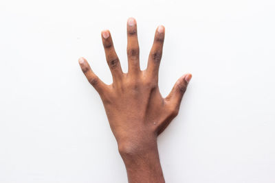 Close-up of hands over white background