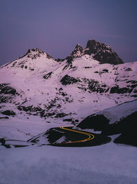 Scenic view of snow covered mountains against sky