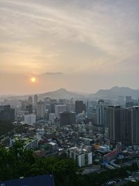 High angle view of buildings against sky during sunset