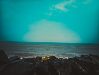 Scenic view of sea against blue sky