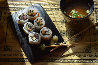 High angle view of sushi served with soup