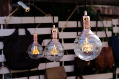Close-up of light bulb hanging