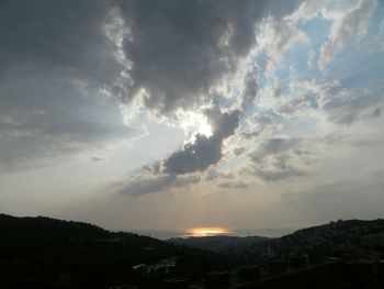 Scenic view of cloudy sky at sunset