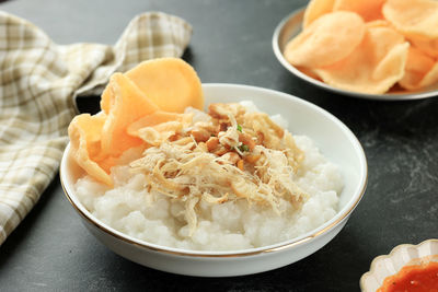 Bubur ayam or chicken porridge, popular street food for breakfast in indonesia