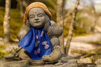 Close-up of statue against rock