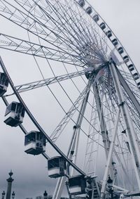 Low angle view of ferris wheel against sky