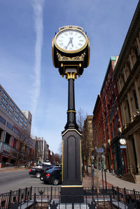 Clock tower against sky in city