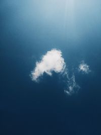 Low angle view of vapor trail in blue sky