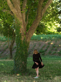 Full length of woman standing on field