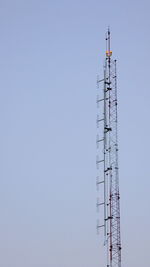 Low angle view of communications tower against clear sky