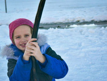 Portrait of smiling girl in snow