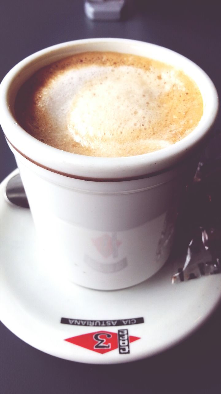 food and drink, indoors, coffee cup, drink, refreshment, coffee - drink, freshness, still life, saucer, close-up, coffee, table, frothy drink, cup, text, western script, cappuccino, communication, froth art, no people