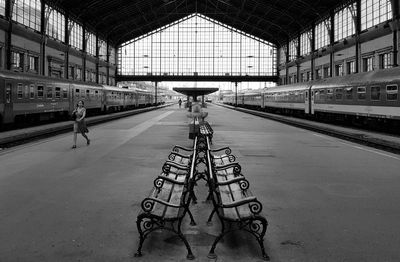 Train at railroad station against sky