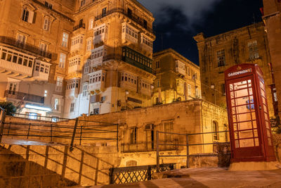 Low angle view of illuminated building at night