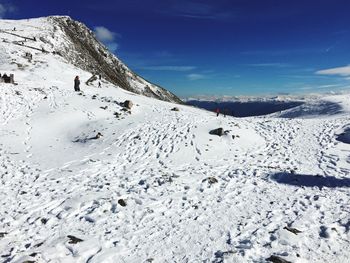 Scenic view of snow covered mountain against sky