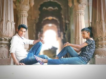 Young couple sitting in temple