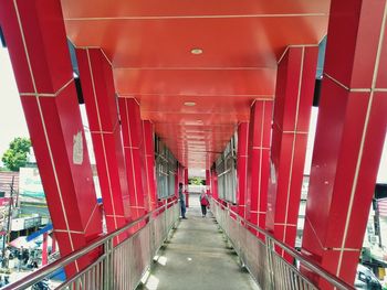 Man walking in corridor of building