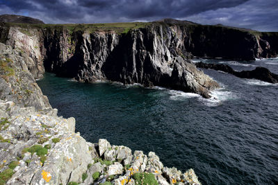 High angle view of rocks by sea