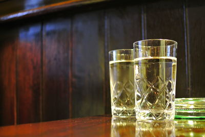 Close-up of drinking glasses on table in restaurant