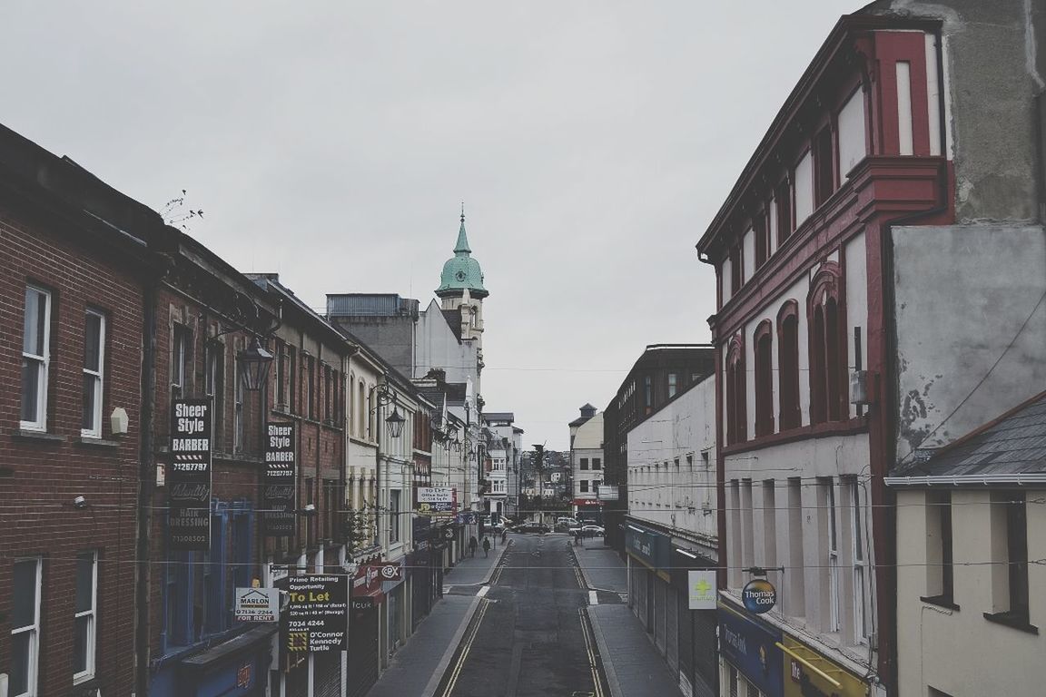 architecture, building exterior, built structure, the way forward, street, city, sky, church, incidental people, transportation, diminishing perspective, religion, travel destinations, place of worship, road, vanishing point, day, clear sky, building