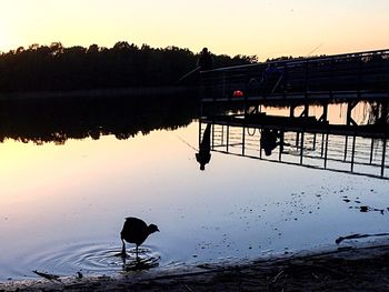 Scenic view of lake at sunset