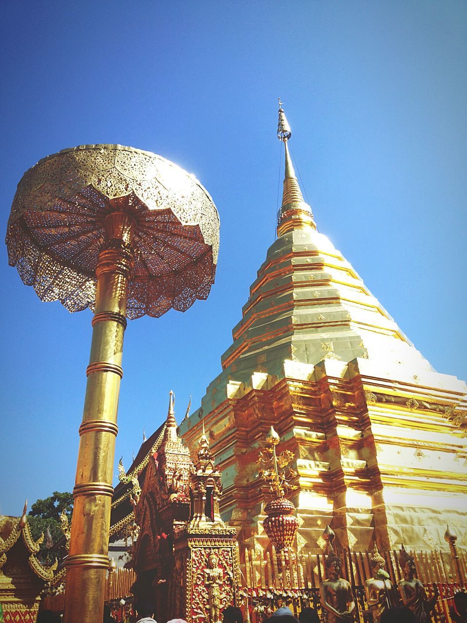 low angle view, clear sky, religion, place of worship, architecture, spirituality, built structure, blue, building exterior, famous place, travel destinations, tourism, international landmark, travel, tower, church, spire, sky, tall - high