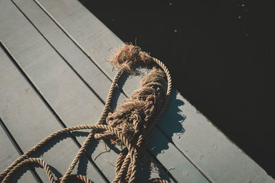 High angle view of rope on jetty over lake