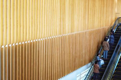 High angle view of man working on metal wall