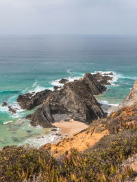 High angle view of sea shore against sky