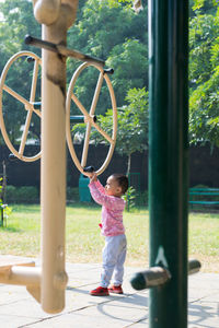 Full length of girl standing at park