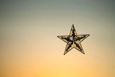 Half star on golden yellow light background.